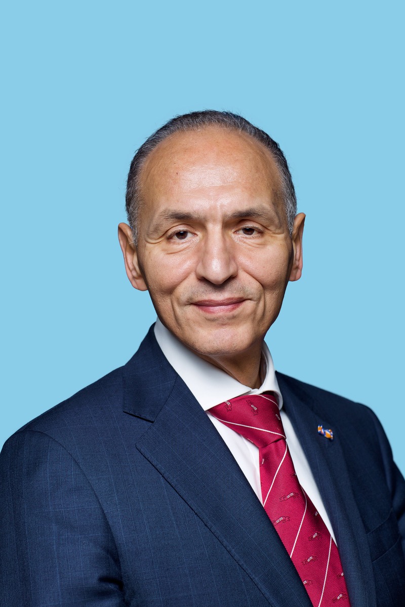 Mr. Mohamed Sini (Chairman)